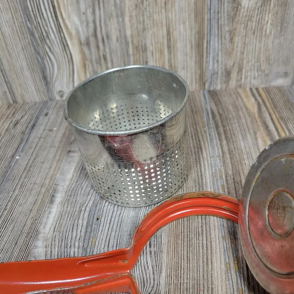 Vintage Handy Things Potato Ricer Red Metal Juicer Press Ludington Michigan MI